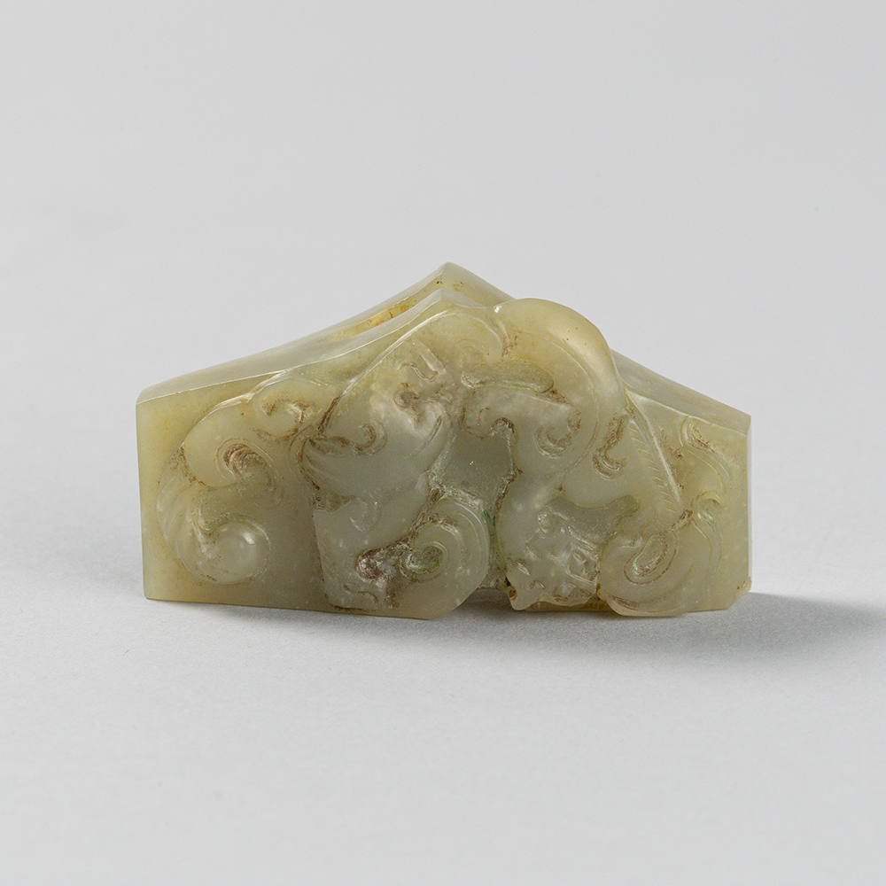 Lot2015 A CELADON JADE SWORD GUARD, WESTERN HAN DYNASTY Western Han Dynasty 2nd century BC to 1st century AD(서한 BC2세기 – AD 1세기)