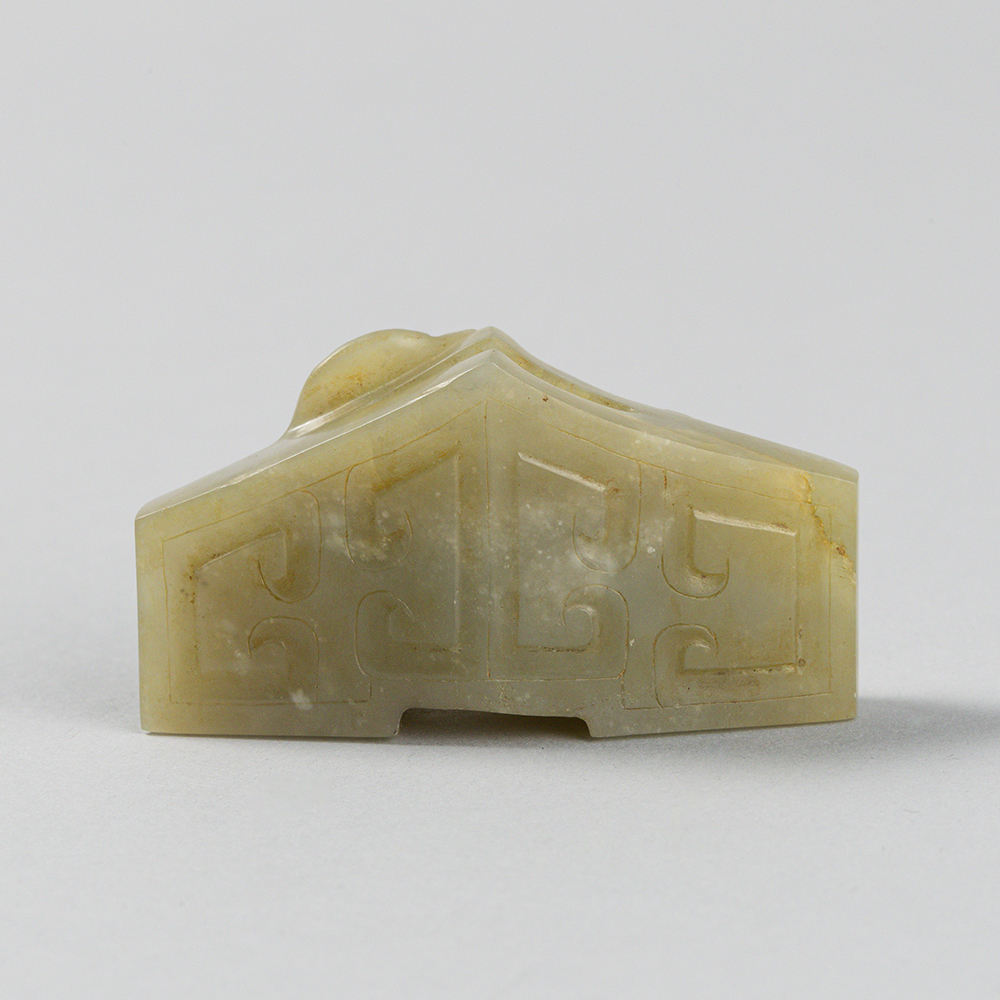 Lot2015 A CELADON JADE SWORD GUARD, WESTERN HAN DYNASTY Western Han Dynasty 2nd century BC to 1st century AD(서한 BC2세기 – AD 1세기)