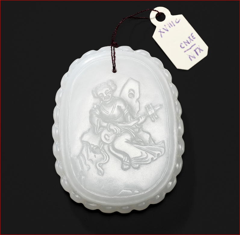 Lot2026 AN INSCRIBED WHITE JADE PLAQUE DEPICTING A LADY PLAYING THE PIPA, 18TH CENTURY